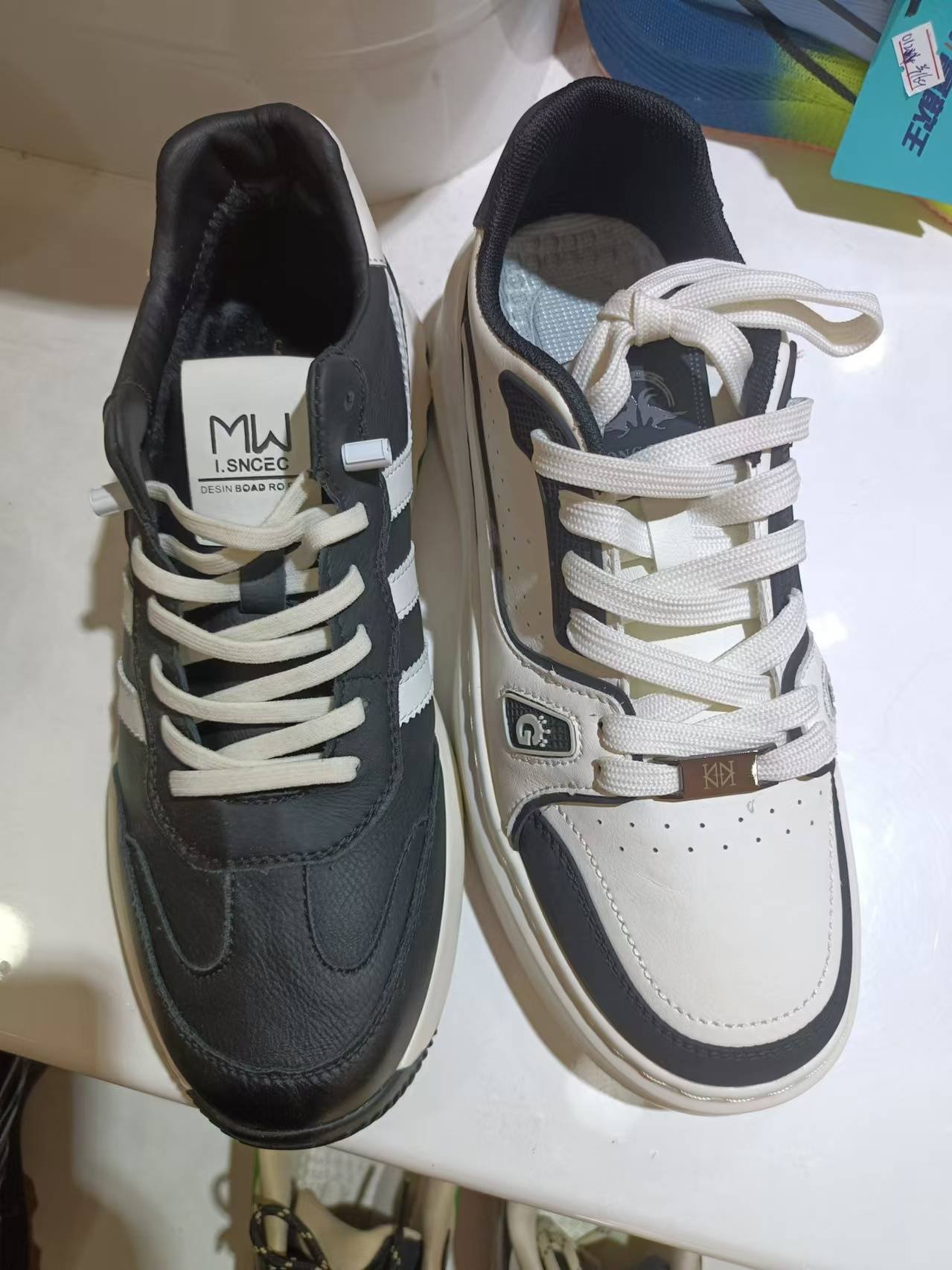 Sleek Elegance Meets Comfort: MW Black and White Patchwork Sneakers